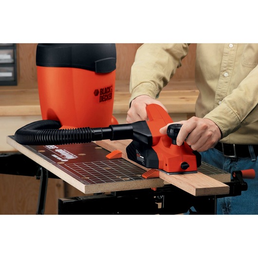 5.2 Amp 3 and a quarter inch Planer being used on wood.