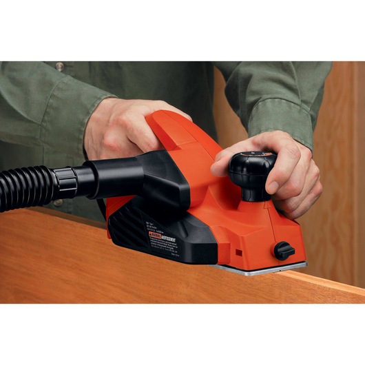 5 and 2 tenths Ampere 3 one quarter inch Planer being used on wooden surface.