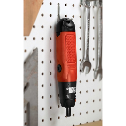 Cordless Screwdriver hanging on tool rack.