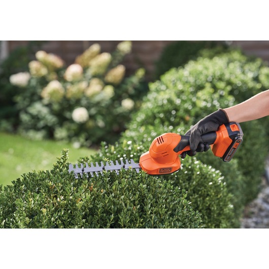 Shear Shrubber being used to level bushes.