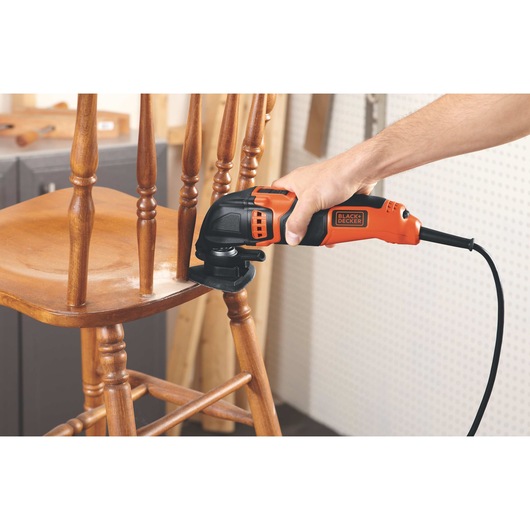 2.5 AMP Oscillating Multi Tool being used on wooden chair.
