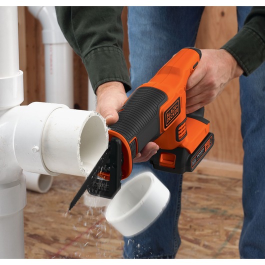 20 volt lithium ion 4 tool combo kit drill cum driver circular saw reciprocating saw and worklight being used.