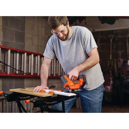 20 volt cordless jigsaw being used by a person.