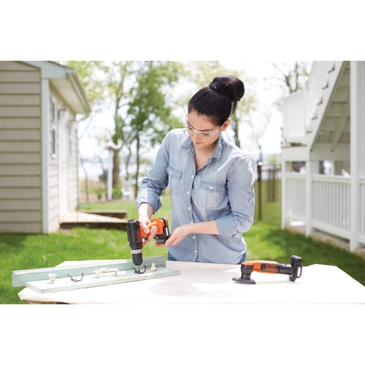 GoPak 4 tool combo kit being used by a person to fix drawer handles.