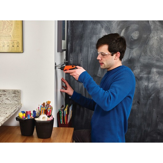 4 volt MAX lithium rechargeable screwdriver being used by a person..