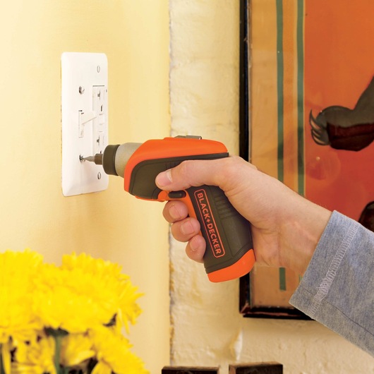 Lithium Rechargeable Screwdriver being used to tighten screw on switch board.