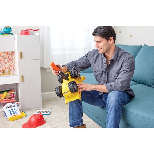 4 volt MAX lithium ion lightdriver cordless screwdriver being used by a person to assemble a toy car.