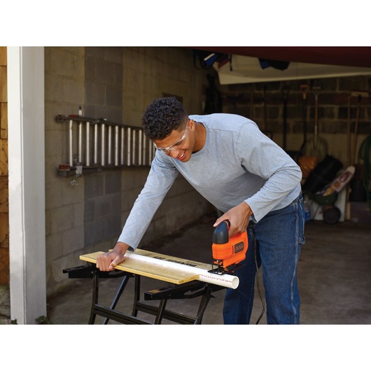 4.5 ampere jigsaw being used by a person.