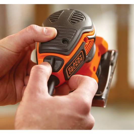 Paddle switch feature of one quarter sheet orbital sander with paddle switch actuation.