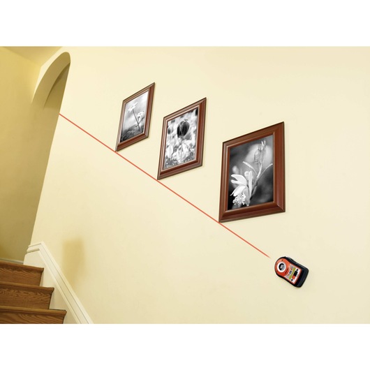 Bulls Eye auto leveling laser with AnglePro being used to hang frames diagonally.