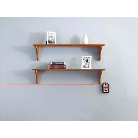Bulls Eye Auto Leveling Laser with Angle Pro being used for leveling wall shelves.