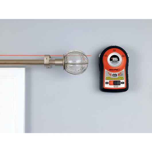 Bulls Eye Auto Leveling Laser with AnglePro mounted on wall being used for precise laser leveling.