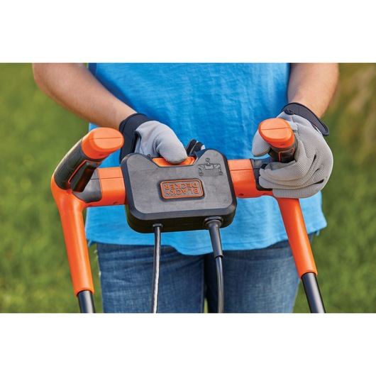Push button start feature of 10 Amp 15 inch Electric Lawn Mower with Comfort Grip Handle.
