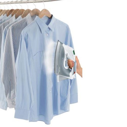 Profile of Digital Advantage Iron with powerful burst of steam coming out on hanged clothes.