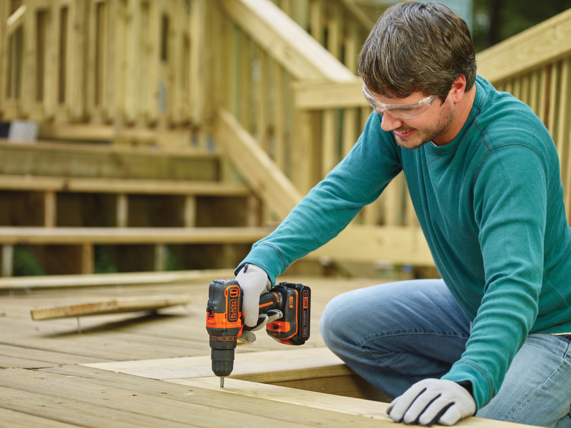 20 volt MAX lithium 2 speed drill driver being used by a person to drill a hole in wood.