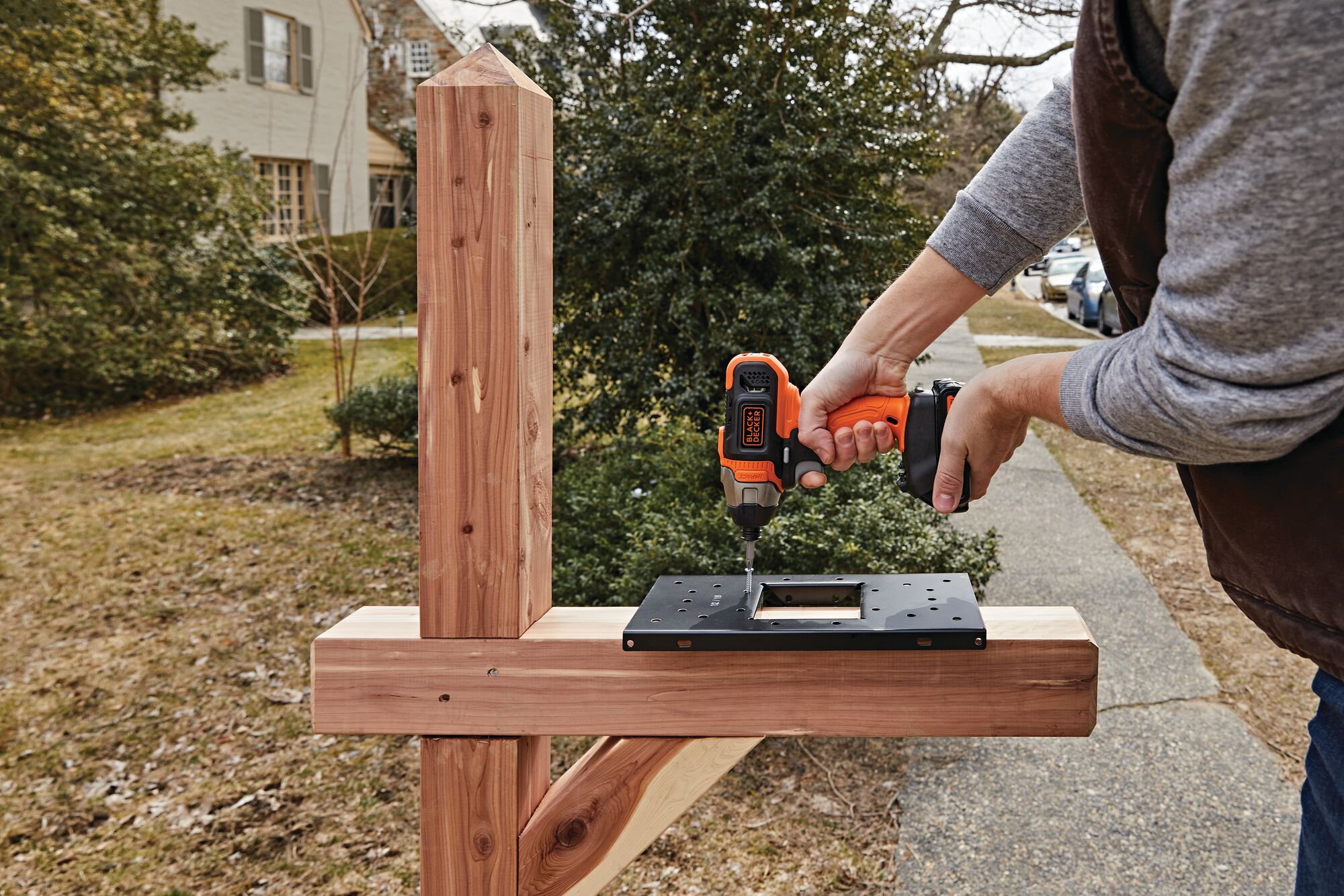 Cordless Impact Driver being used to install letterbox mount.