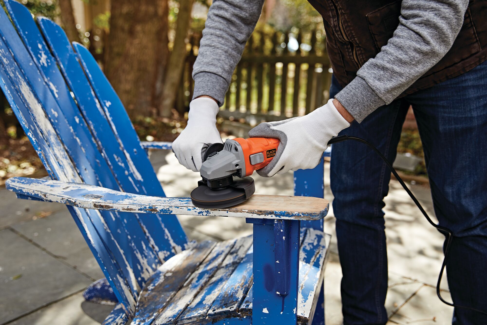 6.2 Amp Small Angle Grinder being used to grind a wooden chair.