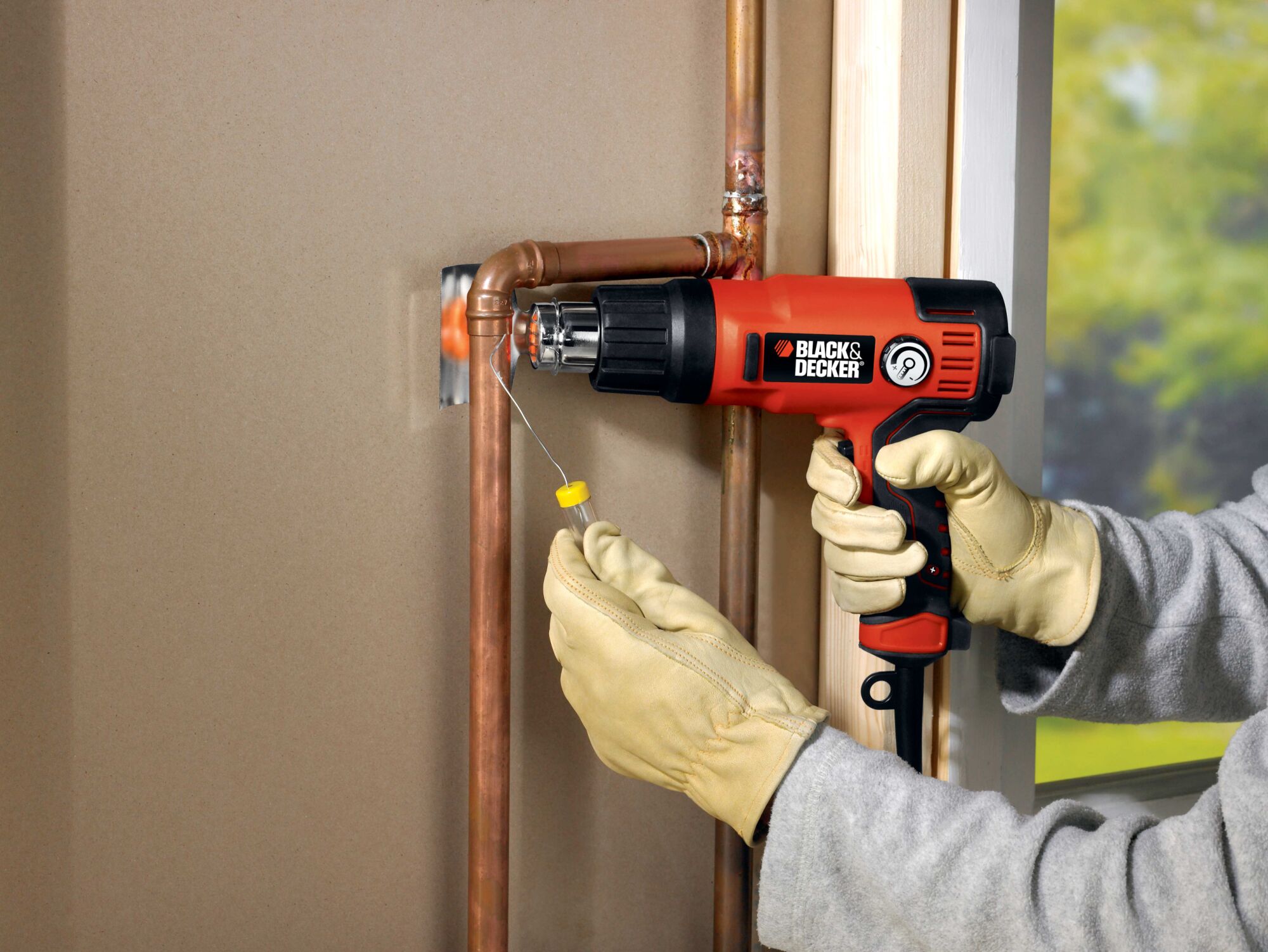 2 speed variable temperature heat gun being used to heat a metal wire.