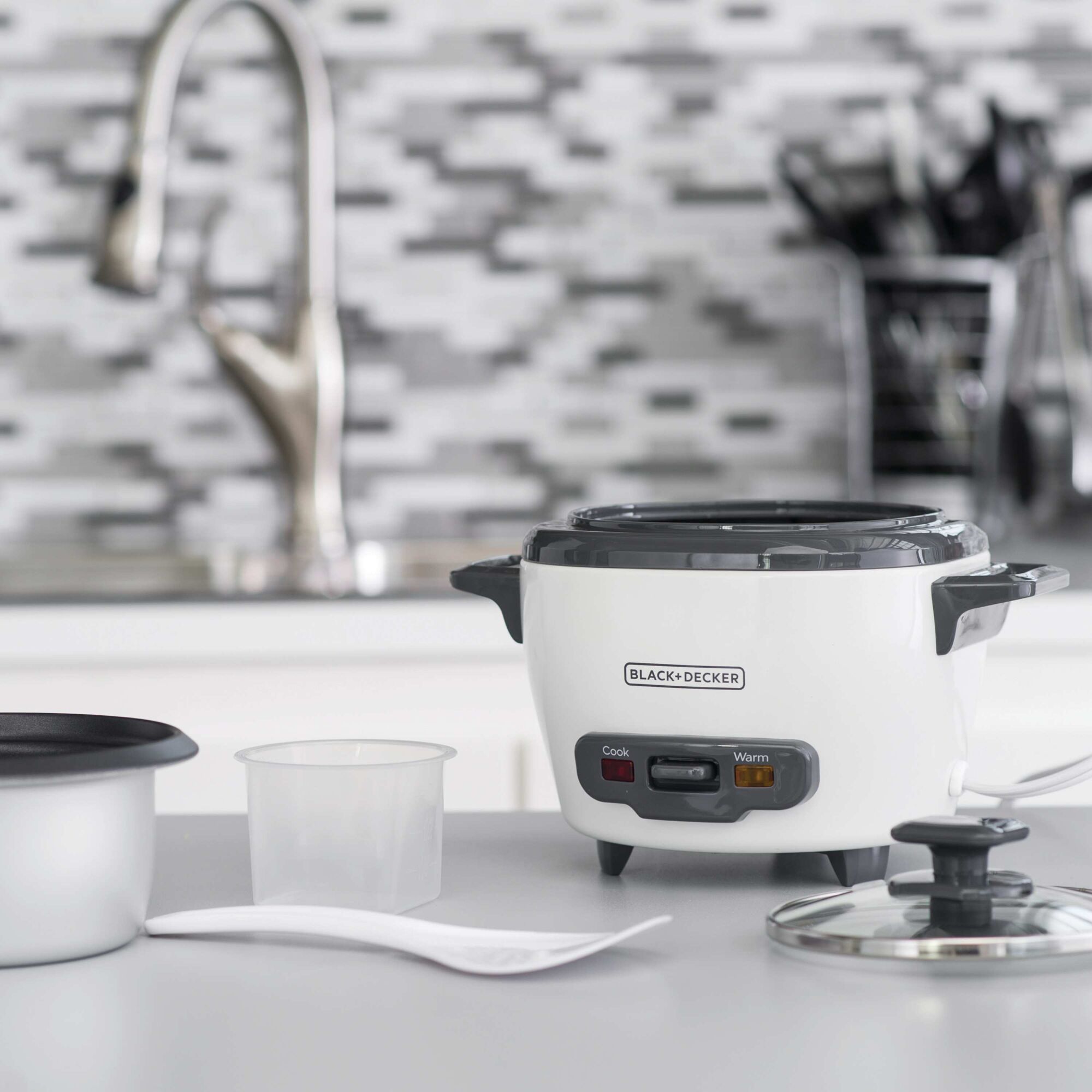 3 cup electric rice cooker with keep warm function white in kitchen.