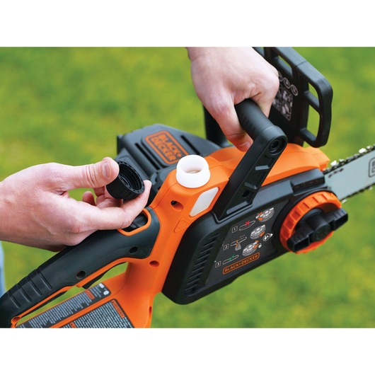 Close up of MAX Lithium 10 inch Chainsaw featuring oiling system for lubrication of bar and chain.