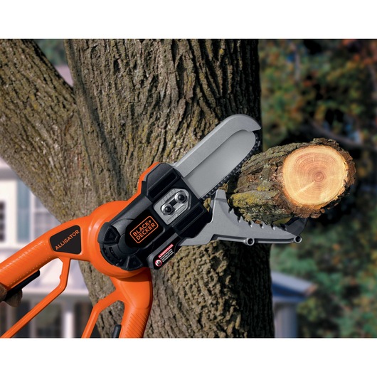 20 Volt MAX Lithium Alligator Lopper being used to cut branch.
