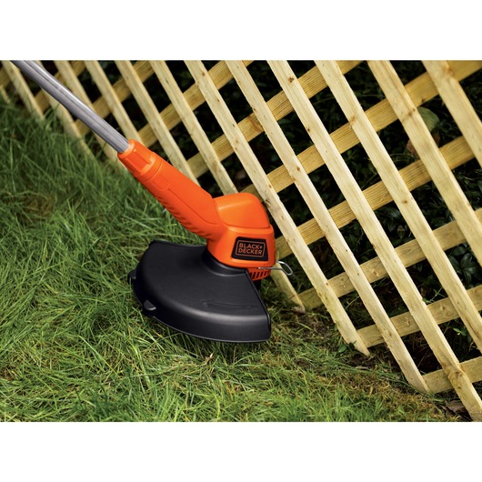 13 inch 2 in 1 Trimmer / edger trimming grass.