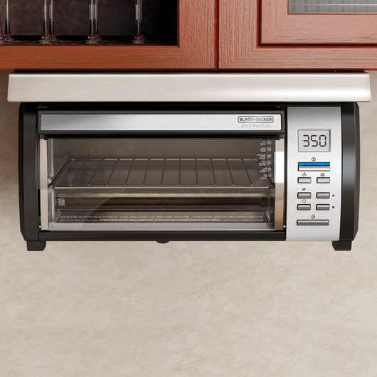 SpaceMaker under the cabinet 4 slice toaster oven fixed underneath a kitchen cabinet.