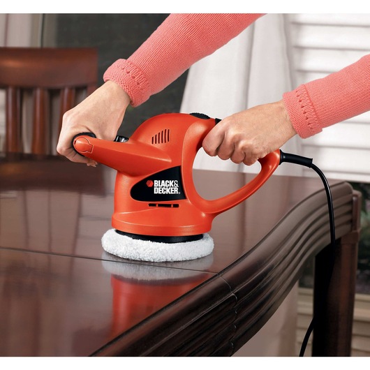 6 inch Random Orbit Waxer Polisher being used to polish wooden table.